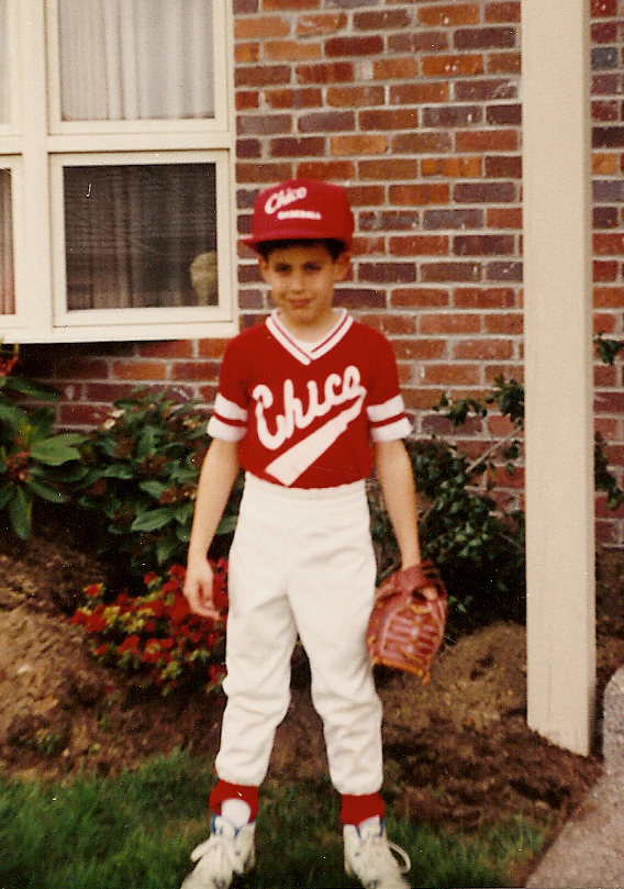 Boy posing in baseball uniform